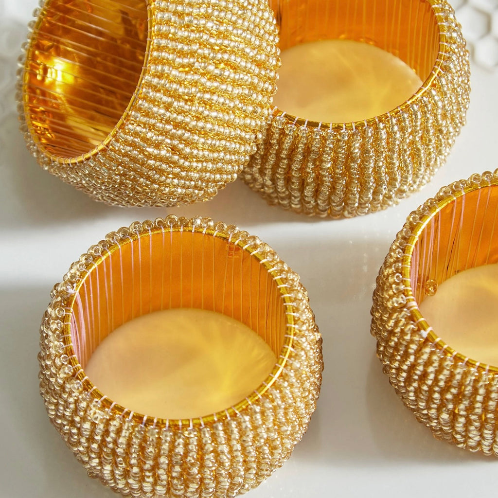 مجموعة من 4 حلقات منديل ذهبية مرصعة بالخرز